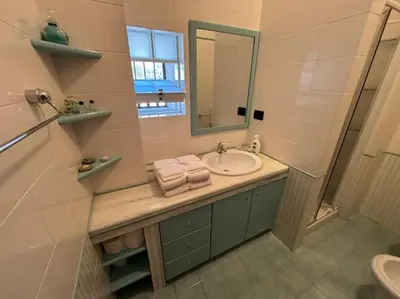 a bathroom with a sink and a mirror at Maison Lume in Castellammare del Golfo