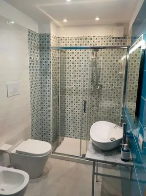 a bathroom with a shower and a toilet and a sink at Casa3Fratelli, via Cutino 16 in Isola delle Femmine