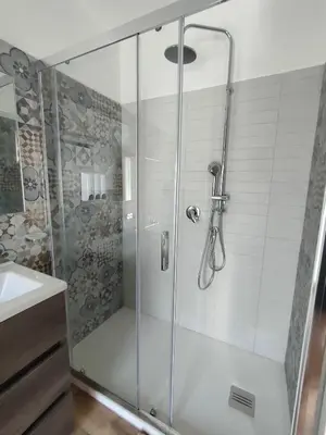 a shower with a glass door in a bathroom at DH Studio Apartments in Castellammare del Golfo