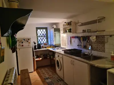 a kitchen with a sink and a dishwasher at Casa e Putia Apartment in Palermo