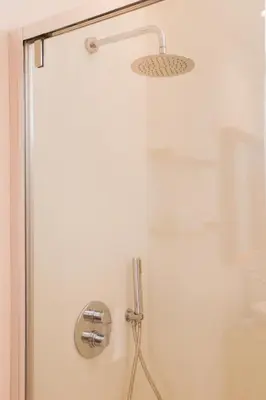 a shower with a shower head in a bathroom at Villa Ippolita - 2 Bedrooms Apartment with Terrace & Garden Exclusive in San Vito lo Capo