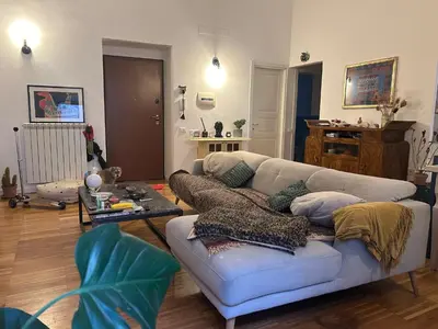 a living room with a mirror on the wall at RoccoLima in Palermo