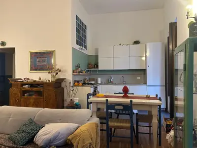 a bedroom with a bed with two towels on it at RoccoLima in Palermo