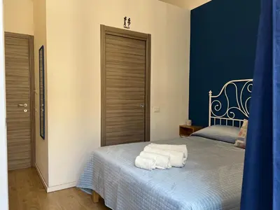 a bedroom with a bed with towels on it at Ricasoli28Apartaments in Palermo