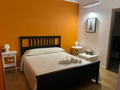 a bedroom with a bed with two towels on it at Ricasoli28Apartaments in Palermo