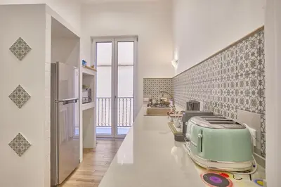 a kitchen with a green toaster on a counter at Zia Marì Casa Vacanze in Palermo