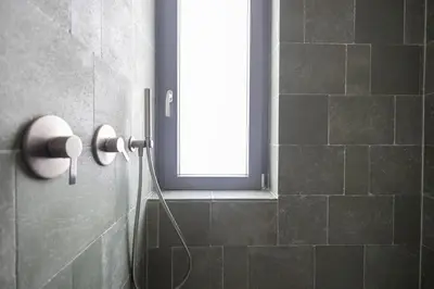 a bathroom with a shower with a window at iFlat Porta di Mare 45 in Palermo