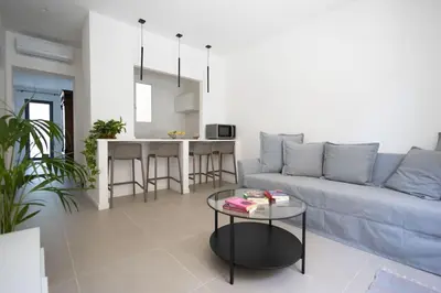 a living room with a couch and a table at iFlat Porta di Mare 45 in Palermo