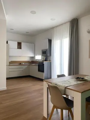 a dining room with a table and two chairs at Casa Salvia in Alcamo