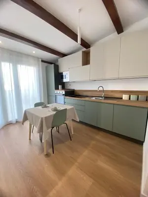 a bedroom with a bed and a tv in a room at Casa Salvia in Alcamo