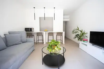 a living room with a couch and a table at iFlat Porta di Mare 49 in Palermo