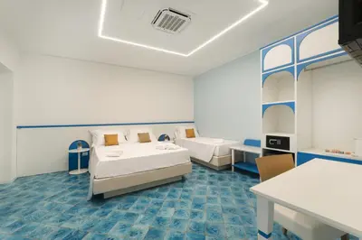 a hospital room with two beds and a table at B&B La Dimora di Poseidone in Bagheria