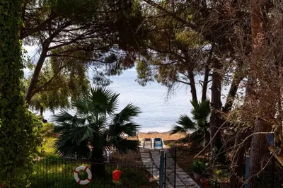 a fence with a soccer ball on the beach at Casa cancello a mare in Santa Flavia