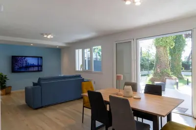 a living room with a table and a couch at Casa cancello a mare in Santa Flavia