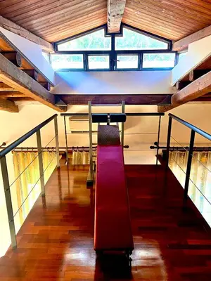 a red slide in the middle of a building at Villa Giovina Mondello in Mondello