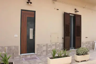 two doors on a building with plants in front of it at Zia Pina Home in Palermo