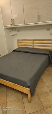 a large bed in a room with at Cappellieri Home in Palermo