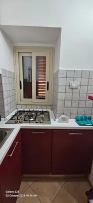 a kitchen with a stove and a sink at Cappellieri Home in Palermo