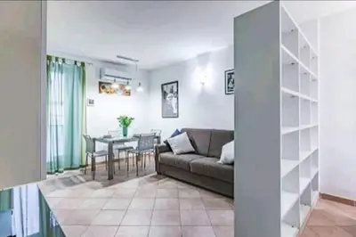 a living room with a couch and a table at Cappellieri Home in Palermo
