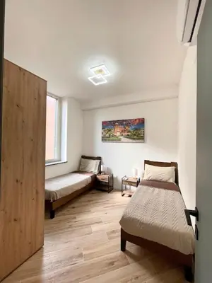 a bedroom with two beds and a window at LB SilvioCentro in Palermo