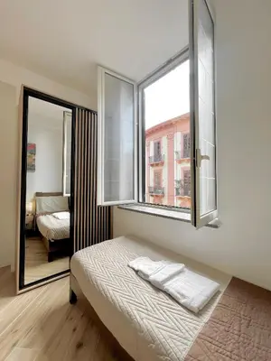 a bedroom with a bed and a window at LB SilvioCentro in Palermo