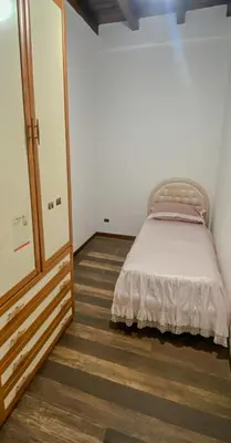 a small bedroom with a bed in a room at La discesa di San Giuseppe in Termini Imerese