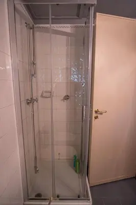 a shower with a glass door in a bathroom at Palermo 3 bedrooms apartment historic center in Palermo