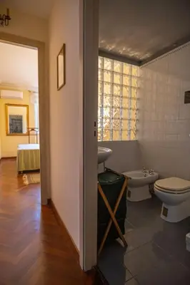 a bathroom with a toilet and a sink at Palermo 3 bedrooms apartment historic center in Palermo