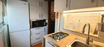 a kitchen with a sink and a stove top oven at Casa Grazia in Palermo