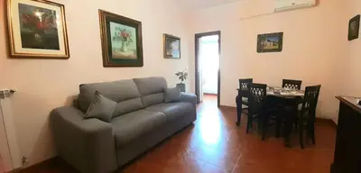 a living room with a couch and a table at Casa Grazia in Palermo