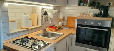 a kitchen with a sink and a stove top oven at Casa Grazia in Palermo