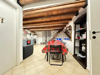 a dining room with a table in a kitchen at Siloe Apartment Palermo in Palermo