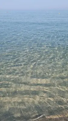 a large body of water with rocks in it at La Casetta di Isola in Isola delle Femmine