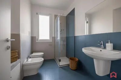 a bathroom with a sink and a toilet and a shower at Villa with Sea view Private Pool in Terrasini