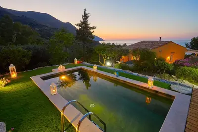 a swimming pool in a yard with a house at Villa Desirée - Scopello-Villas in Scopello