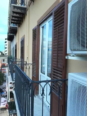 a balcony with a door and a window on a building at Room & Breakfast Zero in Palermo