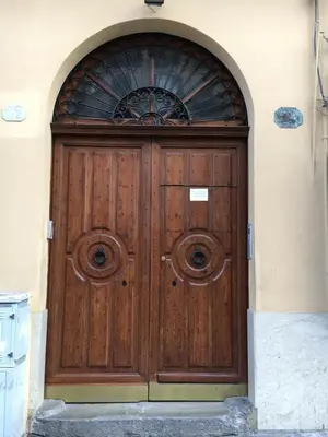 a large wooden door with a window on a building at Room & Breakfast Zero in Palermo