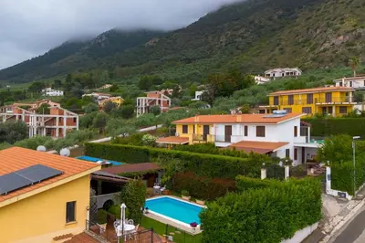 a view of a small town with a mountain at Villa Carmen in Mandra Capreria