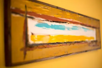 a painting hanging on a wall at Villa Chiara in Scopello