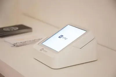 a white electronic device sitting on top of a table at Vittorio Emanuele Suite Apartment in Palermo