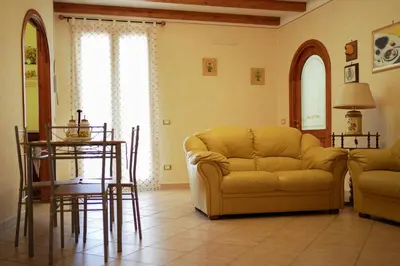 a living room with a couch and a table at O Cannulicchiu in Altofonte