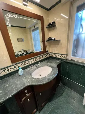 a bathroom with a sink and a mirror at Mondello Tolomea guest house in Mondello
