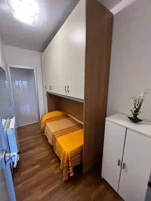 a small room with a bed and a cabinet at Mondello Tolomea guest house in Mondello