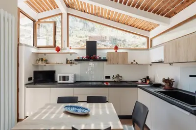 a kitchen with a table with a plate on it at Villa Michela - Dimora di Charme a Cefalù con panorama sul mare by CEFALU BIZ in Cefalù