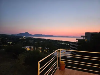 a view of the ocean at sunset from a balcony at Villa Michela - Dimora di Charme a Cefalù con panorama sul mare by CEFALU BIZ in Cefalù