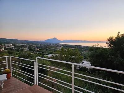 a balcony with a view of the ocean and mountains at Villa Michela - Dimora di Charme a Cefalù con panorama sul mare by CEFALU BIZ in Cefalù