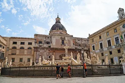 a group of people standing in front of a building at Appartamento Ottanio- Quattro Canti 200 mt in Palermo