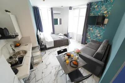 a living room with a couch and a table at Appartamento Ottanio- Quattro Canti 200 mt in Palermo