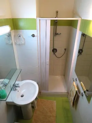 a bathroom with a sink and a shower at Appartamento Blu in Palermo
