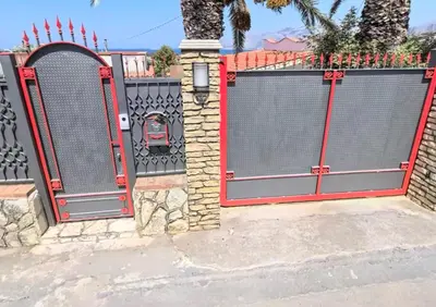 a pair of gates in a fence at Casa Vacanze Anthea Carini in Carini